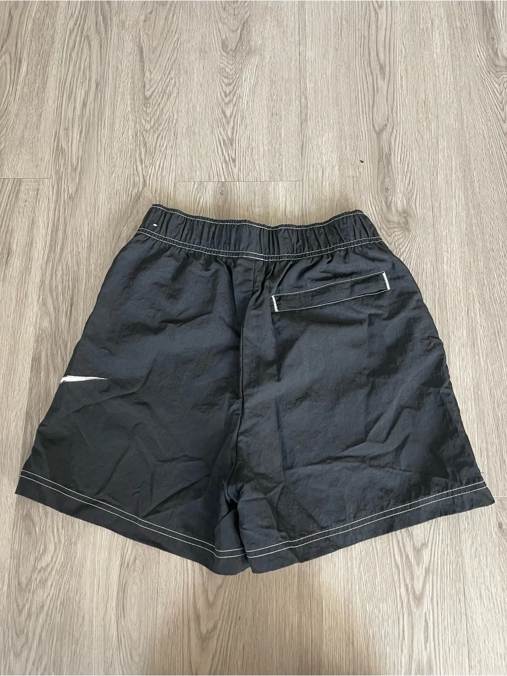 Nike Black Athletic Shorts with White Swoosh Accent